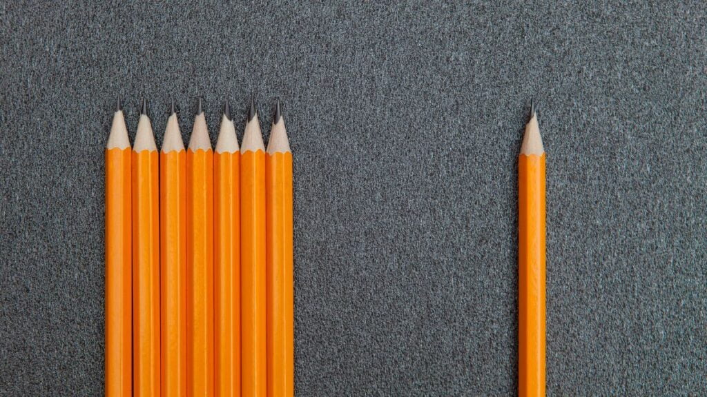 A pencil isolated from others, illustrating the effect of a discussion about drawing styles