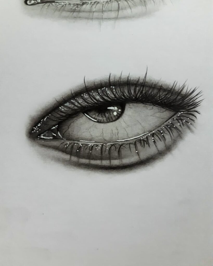 Desenho de um olho realista feito pela desenhista Luana Silva, ilustrando a importância de começarem por desenhos pequenos.