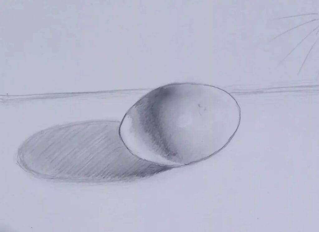 Desenho realista de um ovo sombreado feito pelo desenhista Pedro Damasceno, ilustrando a dica sobre a importância de aprenderem luz e sombra.