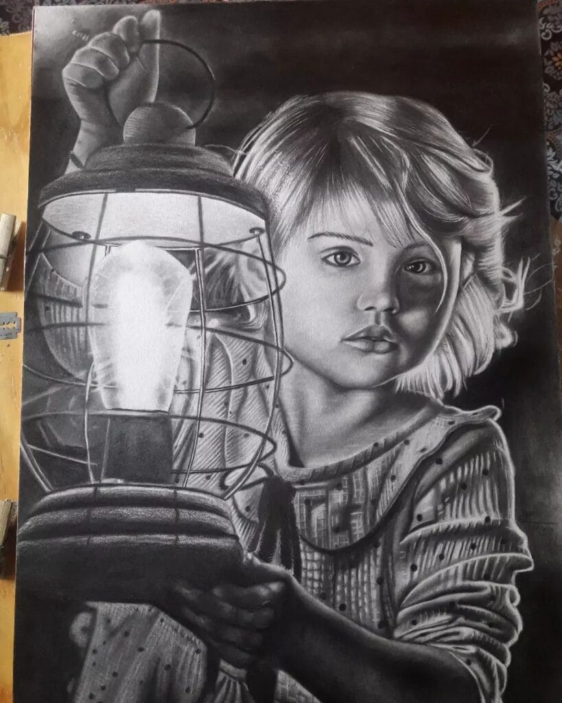 desenho-realista-de-uma-criança-com-muito-contraste-feito-pelo-desenhista-igor-cossa-ilustrando-o-fundamento-luz-e-sombra